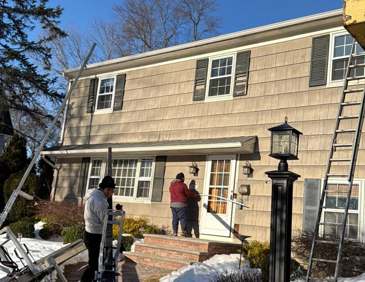 North Valley Exteriors ladders and equipment set up on a New Jersey home