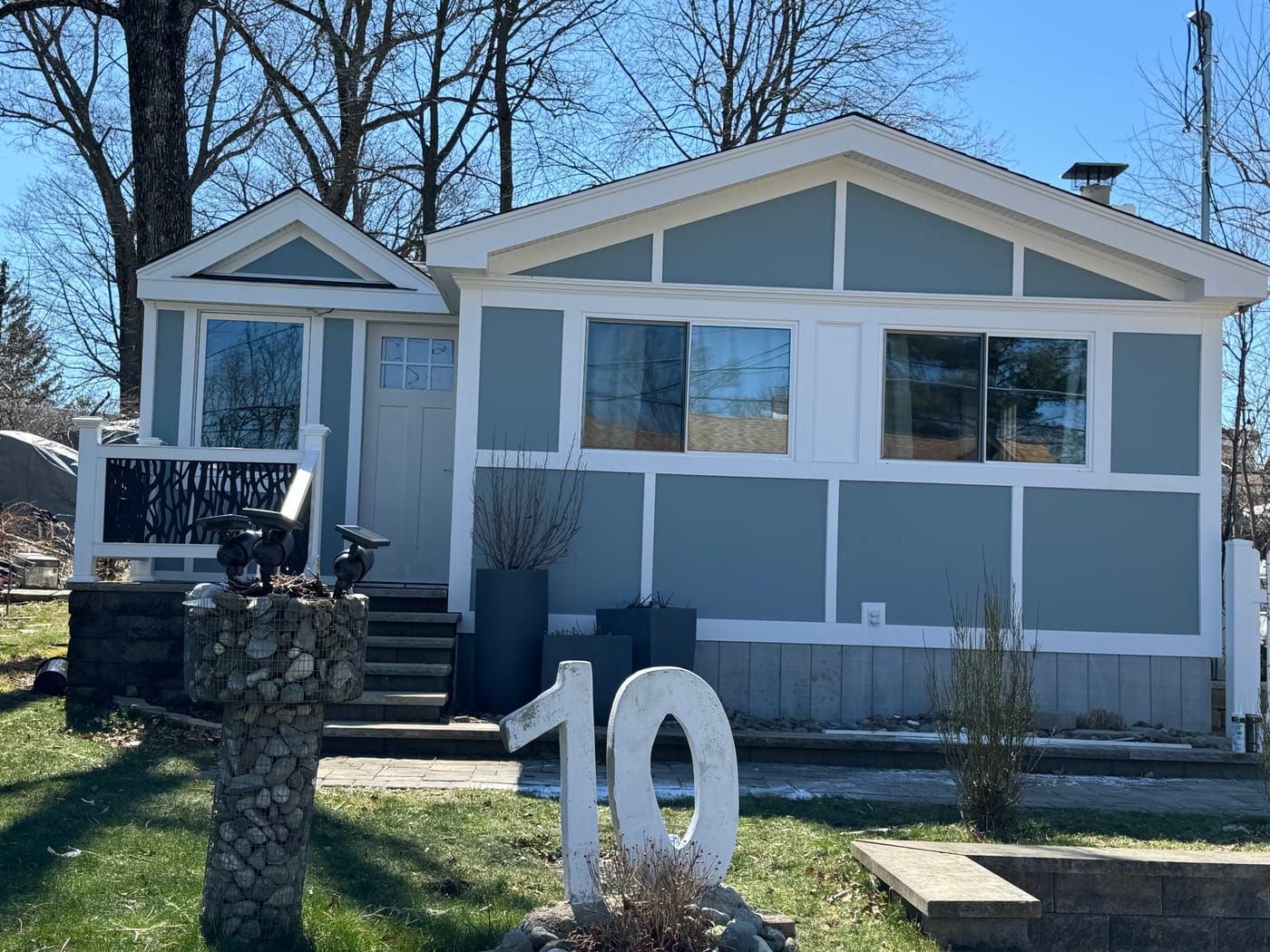 Straight-on front of the cottage with the picket fence