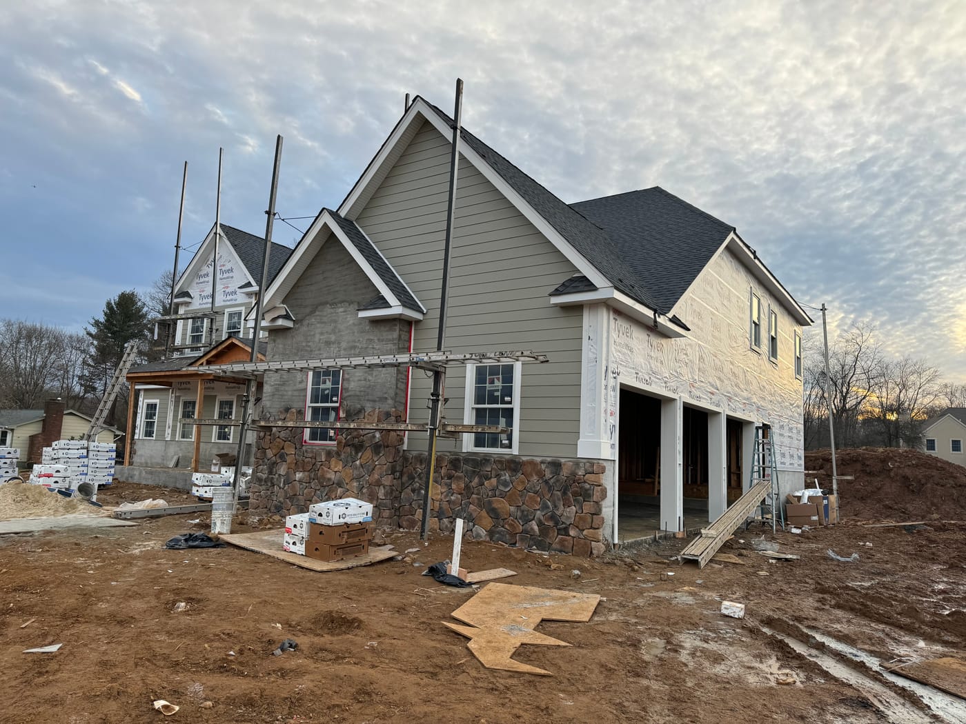 Multicolor fieldstone veneer installed on a gable bump-out